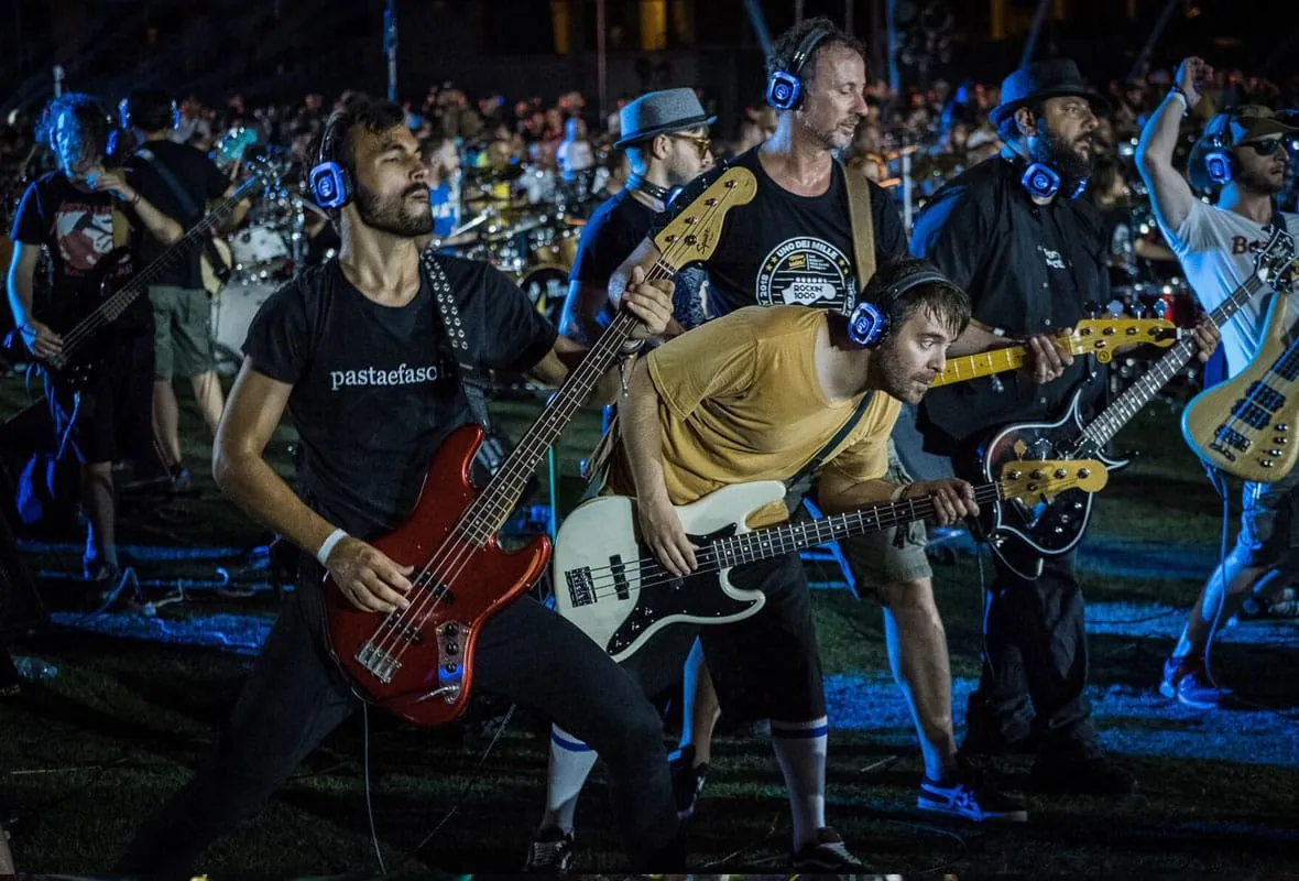 Rockin'1000 - musicians wearing wireless in-ear monitors